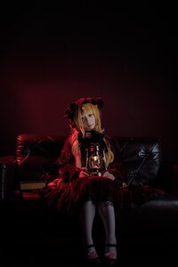 Rating: Safe Score: 0 Tags: 1girl blonde_hair blue_eyes bow chair dark dress shinku short_hair sitting solo User: admin