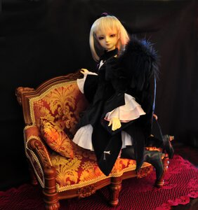 Rating: Safe Score: 0 Tags: 1girl bangs black_eyes blonde_hair book boots doll full_body long_sleeves sitting solo suigintou User: admin