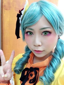 Rating: Safe Score: 0 Tags: 1girl aqua_hair black_ribbon blue_hair braid closed_mouth green_eyes kanaria lips looking_at_viewer photo portrait ribbon smile solo twin_braids User: admin