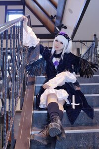 Rating: Safe Score: 0 Tags: 1girl bangs black_legwear boots dress long_hair railing sitting solo suigintou thighhighs User: admin