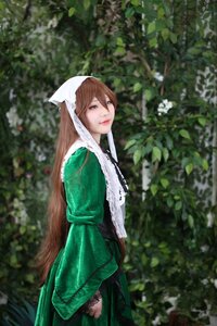 Rating: Safe Score: 0 Tags: 1girl blurry brown_hair closed_mouth depth_of_field dress green_dress head_scarf lips long_hair long_sleeves looking_at_viewer outdoors plant smile solo suiseiseki User: admin