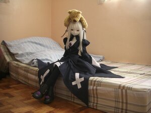 Rating: Safe Score: 0 Tags: 1girl doll dress long_hair long_sleeves red_eyes sitting solo suigintou white_hair wooden_floor User: admin