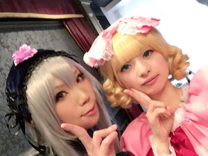 Rating: Safe Score: 0 Tags: 2girls bangs blonde_hair brown_eyes drill_hair finger_to_mouth flower hair_flower hair_ornament hat index_finger_raised lips long_hair looking_at_viewer multiple_cosplay multiple_girls realistic sisters smile tagme User: admin