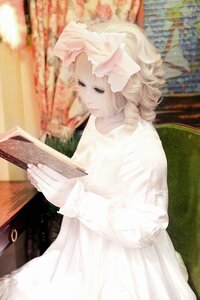 Rating: Safe Score: 0 Tags: 1girl blonde_hair blurry blurry_background blurry_foreground book depth_of_field dress hinaichigo long_sleeves solo striped User: admin