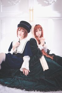 Rating: Safe Score: 0 Tags: 2girls back-to-back bangs brown_hair dress hand_on_own_chest hat lips long_sleeves looking_at_viewer multiple_cosplay multiple_girls red_hair short_hair siblings sisters sitting tagme twins User: admin