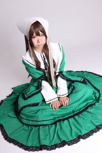 Rating: Safe Score: 0 Tags: 1girl brown_hair dress green_dress grey_background long_hair long_sleeves looking_at_viewer sitting solo suiseiseki v_arms User: admin