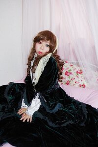 Rating: Safe Score: 0 Tags: 1girl black_dress braid brown_hair dress frills green_eyes heterochromia lips long_hair long_sleeves looking_at_viewer red_eyes sitting solo suiseiseki v_arms User: admin