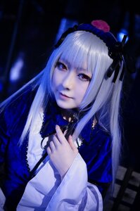 Rating: Safe Score: 0 Tags: 1girl bangs black_ribbon closed_mouth dress hairband holding lips long_hair long_sleeves looking_at_viewer red_eyes ribbon solo suigintou upper_body User: admin