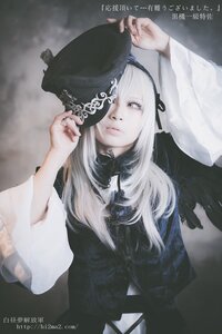 Rating: Safe Score: 0 Tags: 1girl bangs black_ribbon closed_mouth hand_on_headwear hat holding long_hair long_sleeves looking_at_viewer ribbon solo suigintou upper_body watermark web_address white_hair User: admin