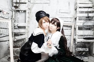 Rating: Safe Score: 0 Tags: 2girls blonde_hair brown_hair building city dress green_eyes hat long_hair multiple_cosplay multiple_girls tagme User: admin