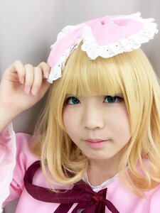 Rating: Safe Score: 0 Tags: 1girl bangs blonde_hair blunt_bangs bow closed_mouth green_eyes hat hinaichigo lips looking_at_viewer nose portrait realistic ribbon smile solo striped vertical_stripes User: admin