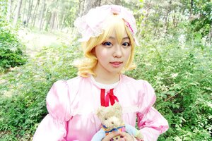 Rating: Safe Score: 0 Tags: 1girl animal blonde_hair blue_eyes day dress hat hinaichigo lips looking_at_viewer outdoors ribbon smile solo striped upper_body vertical_stripes User: admin