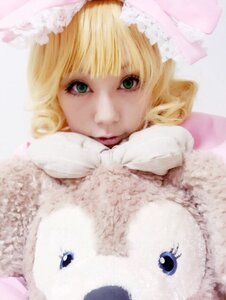 Rating: Safe Score: 0 Tags: 1girl bangs blonde_hair blurry closed_mouth depth_of_field green_eyes hat hinaichigo looking_at_viewer mittens scarf short_hair smile solo striped sweater User: admin