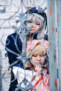 Rating: Safe Score: 0 Tags: 2girls bangs blonde_hair blurry blurry_background blurry_foreground closed_eyes closed_mouth depth_of_field dress hairband long_hair long_sleeves motion_blur multiple_cosplay multiple_girls photo ribbon tagme User: admin