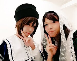 Rating: Safe Score: 0 Tags: 2girls bangs brown_hair closed_mouth hat lace lips looking_at_viewer multiple_cosplay multiple_girls realistic short_hair sisters smile striped tagme v User: admin