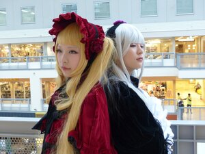 Rating: Safe Score: 0 Tags: 2girls bangs blonde_hair blue_eyes blunt_bangs bonnet building city flower hat indoors lips long_hair looking_at_viewer multiple_girls realistic rose shinku window User: admin