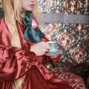 Rating: Safe Score: 0 Tags: 1girl blonde_hair blurry blurry_foreground bow bowtie depth_of_field dress hair_ribbon head_out_of_frame long_hair long_sleeves photo ribbon shinku solo User: admin