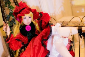 Rating: Safe Score: 0 Tags: 1girl blonde_hair blue_eyes bow chain dress flower long_hair long_sleeves photo red_dress shinku sitting solo User: admin