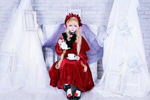 Rating: Safe Score: 0 Tags: 1girl blonde_hair blue_eyes building dress flower red_dress rose shinku shoes sitting solo white_legwear User: admin