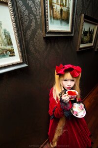 Rating: Safe Score: 0 Tags: 1girl blonde_hair blue_eyes bookshelf bow cup dress indoors lolita_fashion long_hair painting_(object) realistic red_dress shinku solo teacup traditional_media User: admin