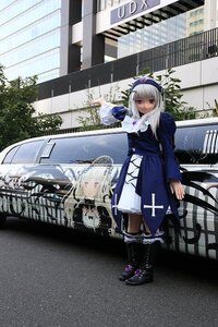 Rating: Safe Score: 0 Tags: 1girl bangs dress flower frills hairband long_hair long_sleeves looking_at_viewer outdoors red_eyes reflection solo standing suigintou water User: admin
