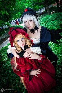 Rating: Safe Score: 0 Tags: 2girls blonde_hair blue_eyes bonnet dress hat lips long_sleeves multiple_cosplay multiple_girls outdoors realistic red_dress shinku suigintou tagme tree wings User: admin
