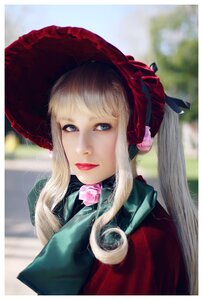 Rating: Safe Score: 0 Tags: 1girl bangs blonde_hair blue_eyes blurry blurry_background bonnet depth_of_field flower lips long_hair looking_at_viewer mouth_hold photo rose shinku solo upper_body User: admin