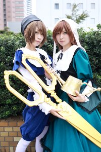 Rating: Safe Score: 0 Tags: 2girls apron blonde_hair blue_dress blue_eyes blurry brown_hair building dress hat long_hair multiple_cosplay multiple_girls outdoors short_hair tagme User: admin