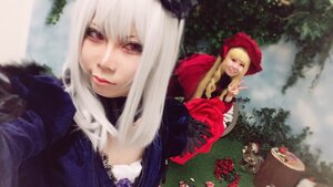 Rating: Safe Score: 0 Tags: 2girls blonde_hair blurry depth_of_field dress flower fur_trim lips long_hair looking_at_viewer multiple_cosplay multiple_girls red_eyes shinku suigintou tagme white_hair User: admin