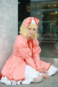 Rating: Safe Score: 0 Tags: 1girl blonde_hair blurry bow curly_hair depth_of_field dress frills hair_bow hina_ichigo hinaichigo long_sleeves looking_at_viewer necktie photo pink_bow pink_dress sitting smile solo User: admin