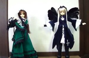 Rating: Safe Score: 0 Tags: 2girls black_wings blonde_hair brown_hair cross doll dress long_hair long_sleeves multiple_dolls multiple_girls shinku standing suigintou suiseiseki tagme wings User: admin