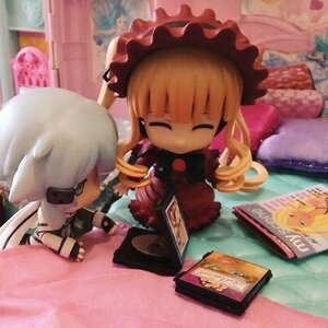 Rating: Safe Score: 0 Tags: 1girl book closed_eyes doll dress long_hair pillow shinku sitting sleeping solo User: admin
