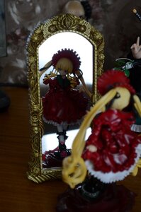 Rating: Safe Score: 0 Tags: 1girl blonde_hair blurry blurry_foreground bow depth_of_field doll dress flower red_dress rose shinku solo User: admin