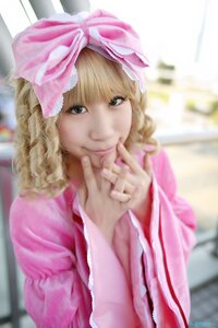 Rating: Safe Score: 0 Tags: 1girl bangs blonde_hair blurry blurry_background blurry_foreground bow closed_mouth curly_hair day depth_of_field green_eyes hair_bow hinaichigo lips looking_at_viewer nose outdoors photorealistic pink_ribbon realistic smile solo upper_body User: admin