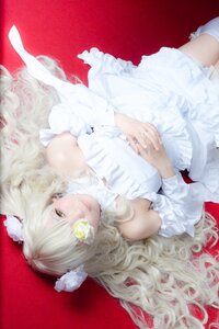 Rating: Safe Score: 0 Tags: 1girl bangs bare_shoulders blonde_hair dress frills hands_together kirakishou lips long_hair lying own_hands_together red_background solo white_dress yellow_eyes User: admin