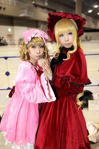 Rating: Safe Score: 0 Tags: 2girls blonde_hair blue_eyes blurry blurry_background bonnet depth_of_field dress drill_hair flower frills long_hair long_sleeves looking_at_viewer multiple_cosplay multiple_girls red_dress shinku siblings sisters standing tagme twins User: admin