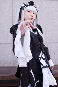 Rating: Safe Score: 0 Tags: 1girl 3d bangs blurry blurry_background depth_of_field flower gothic_lolita hairband long_hair long_sleeves photo solo standing suigintou User: admin