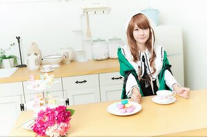 Rating: Safe Score: 0 Tags: 1girl brown_hair cake cup dress flower food fork green_dress green_eyes heterochromia long_hair plate smile solo suiseiseki table teacup User: admin