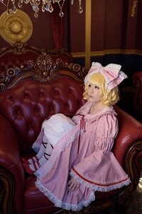 Rating: Safe Score: 0 Tags: 1girl blonde_hair blue_eyes bow chair couch dress frills hair_bow hinaichigo indoors lips long_sleeves pink_dress ribbon short_hair sitting solo User: admin