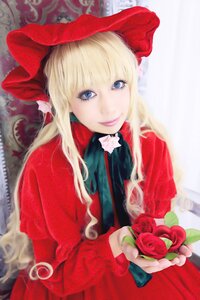 Rating: Safe Score: 0 Tags: 1girl blonde_hair blue_eyes blurry bow depth_of_field dress flower holding_flower lips long_hair long_sleeves looking_at_viewer red_capelet red_dress red_flower red_rose rose shinku sidelocks smile solo User: admin
