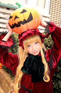 Rating: Safe Score: 0 Tags: 1girl bangs blonde_hair blue_eyes bonnet building dress halloween jack-o'-lantern long_hair looking_at_viewer outdoors pumpkin shinku smile solo User: admin