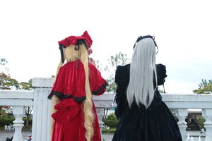 Rating: Safe Score: 0 Tags: 2girls black_dress blonde_hair building dress facing_away long_hair multiple_cosplay multiple_girls standing tagme tree User: admin