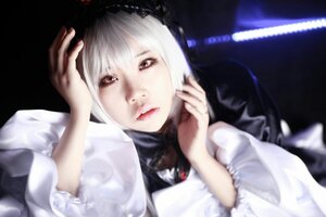 Rating: Safe Score: 0 Tags: 1girl bangs black_background blurry blurry_background bow closed_mouth depth_of_field dress lips long_sleeves looking_at_viewer short_hair solo suigintou upper_body white_hair User: admin