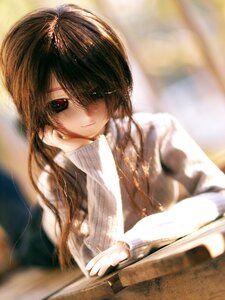 Rating: Safe Score: 0 Tags: 1girl blurry blurry_foreground brown_hair depth_of_field doll hair_over_one_eye indoors long_hair long_sleeves looking_at_viewer smile solo suiseiseki sweater User: admin