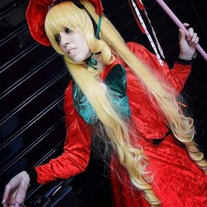 Rating: Safe Score: 0 Tags: 1girl blonde_hair dress flower gun holding_gun long_hair red_dress shinku solo weapon User: admin
