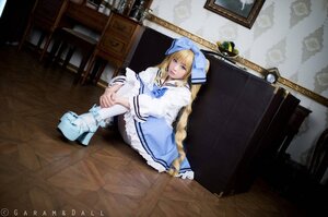 Rating: Safe Score: 0 Tags: 1girl blonde_hair blue_eyes boots bow braid capelet copyright_name dress long_hair shinku sitting solo very_long_hair white_dress white_legwear User: admin