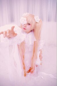 Rating: Safe Score: 0 Tags: 1girl blonde_hair dress flower kirakishou lips long_hair outstretched_hand sitting solo striped vertical_stripes User: admin