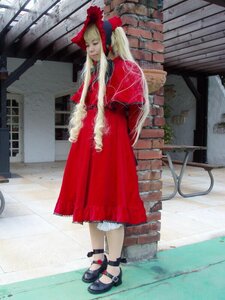 Rating: Safe Score: 0 Tags: 1girl bangs blonde_hair bonnet closed_eyes dress frills full_body long_hair outdoors red_dress shinku shoes solo standing window User: admin