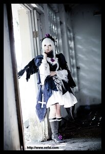 Rating: Safe Score: 0 Tags: 1girl bird black_border boots crow dress gun letterboxed long_hair pillarboxed solo standing suigintou weapon User: admin