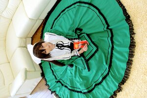 Rating: Safe Score: 0 Tags: brown_hair dress frills from_above green_dress long_sleeves looking_at_viewer ribbon sitting smile solo suiseiseki User: admin